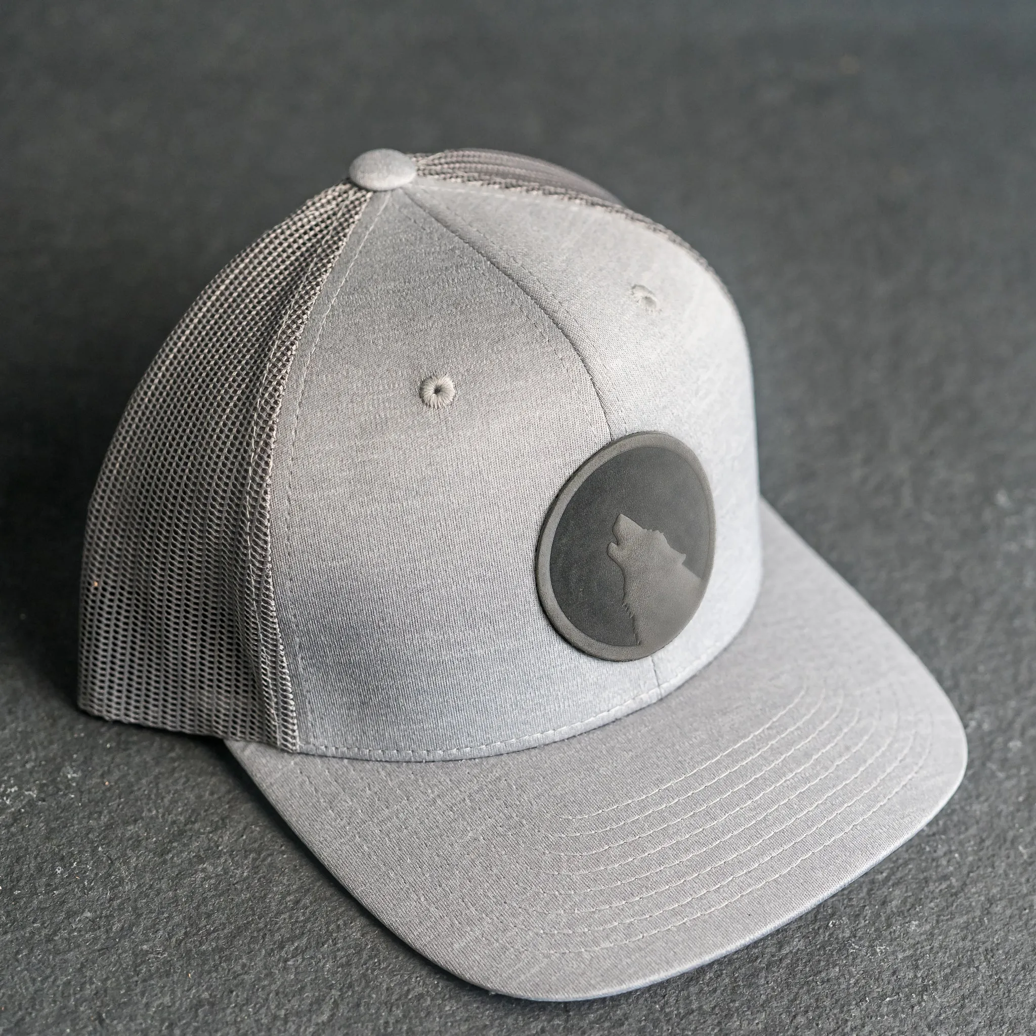 Leather Patch Performance Style Trucker Hat - Wolf Stamp