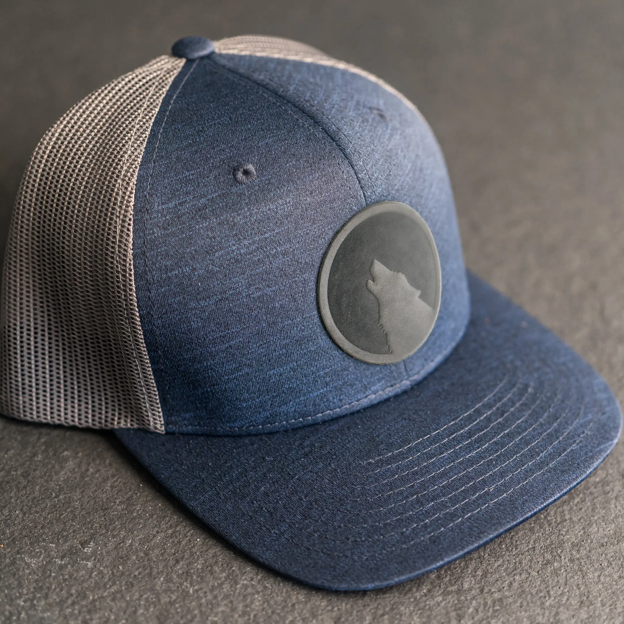 Leather Patch Performance Style Trucker Hat - Wolf Stamp